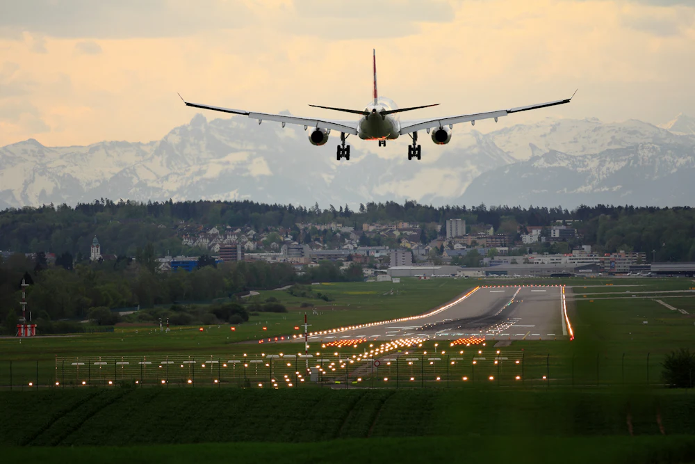 Aircraft landing near a New England town, arriving travelers who need a car rental in Derry, NH